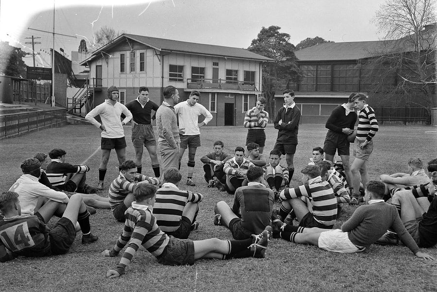 Sydney Grammar rugby players gathered on the field — photograph, from Sydney CBD, 1954