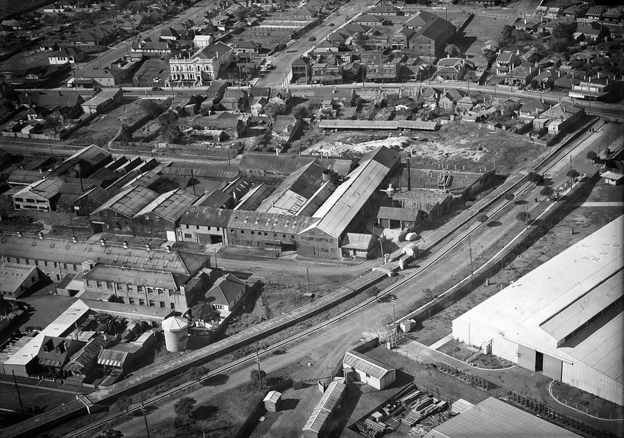 Factory rooftops and terrace streets from the air, Sydney — photograph, c. 1940