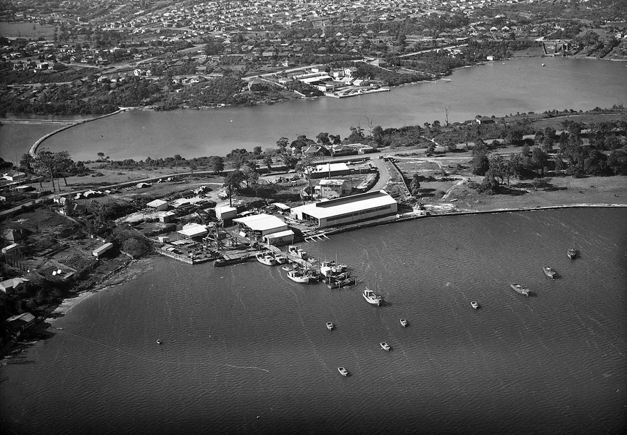 Aerial view of a Flemington waterfront works and moored boats — photograph, from The Crescent, 1930–50