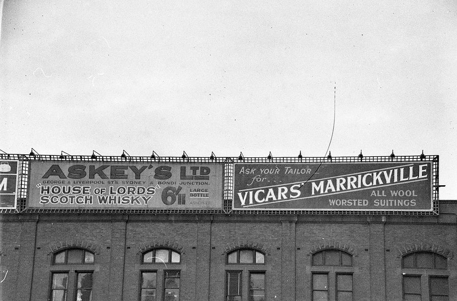 Sky-signs on Central Station Building: Askey's Scotch Whisky and Vicars' Marrickville — photograph, from Central Station, c. 1930s