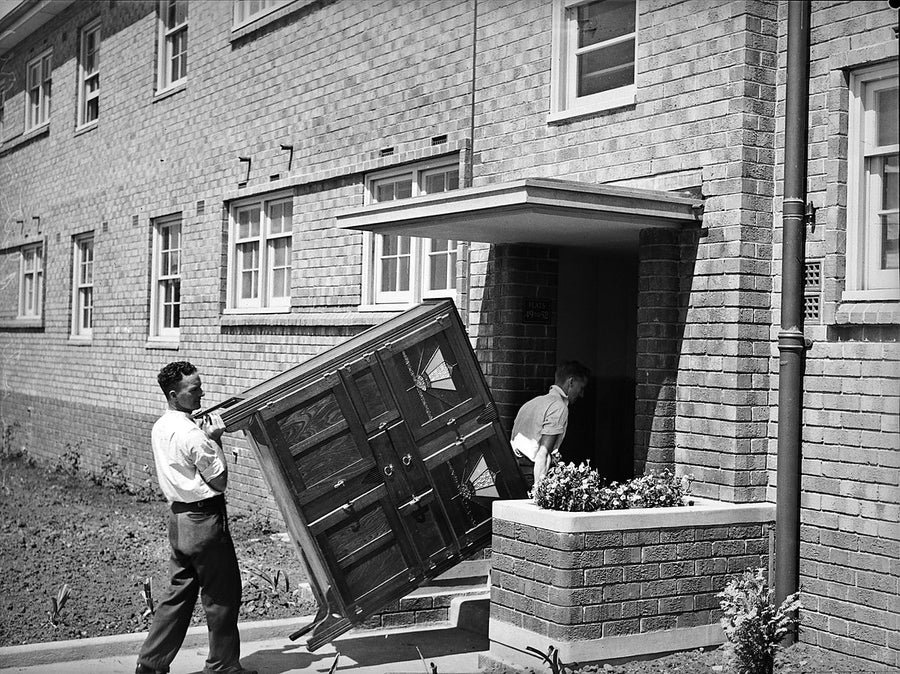 Carrying a sideboard into new flats at Erskineville — photograph, from Erskineville, 1938