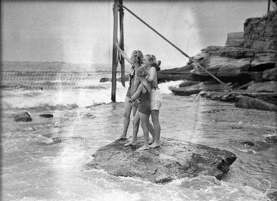 Bathers on the rocks at Coogee Beach — photograph, from Coogee Beach, 1936