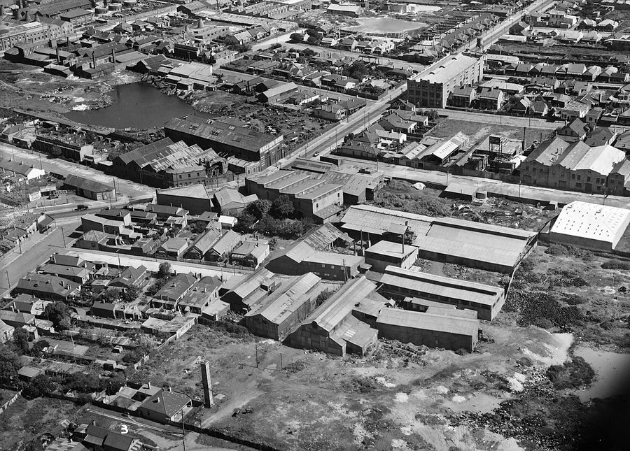 Marrickville from the air: terrace grid, factories and claypit pond — photograph, from Marrickville, after 1935