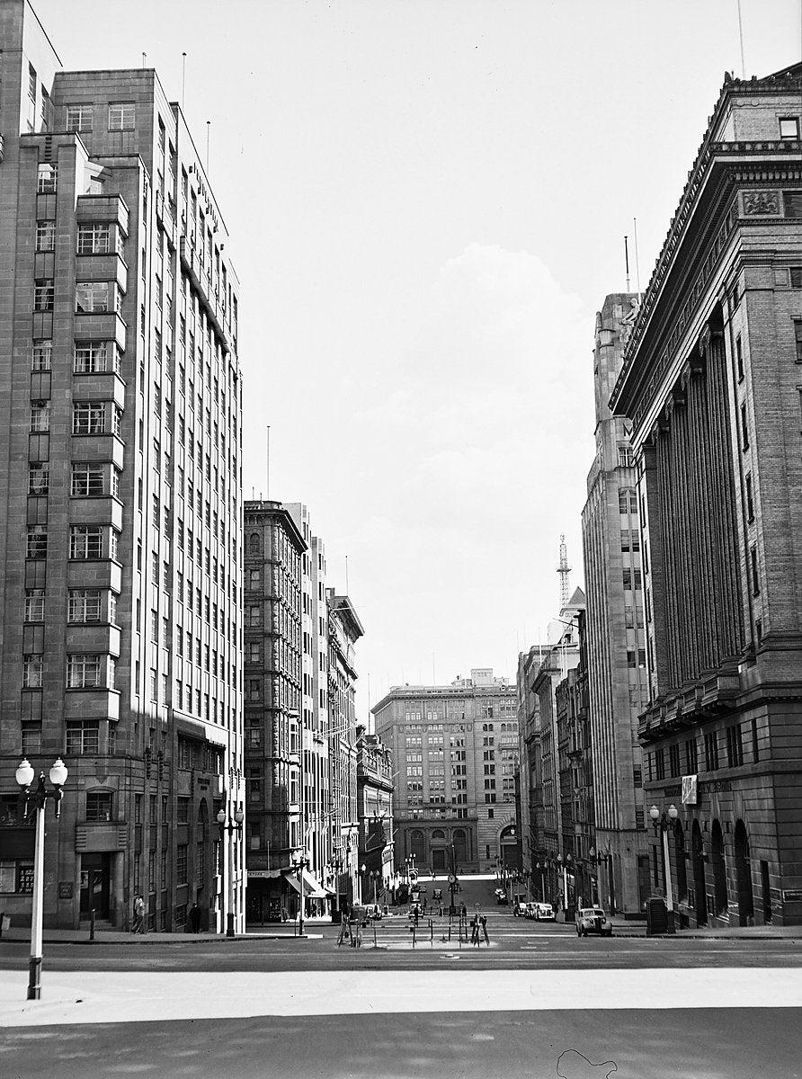 Wide Sydney city street with surveyors' tripods — photograph, from Sydney, 1951