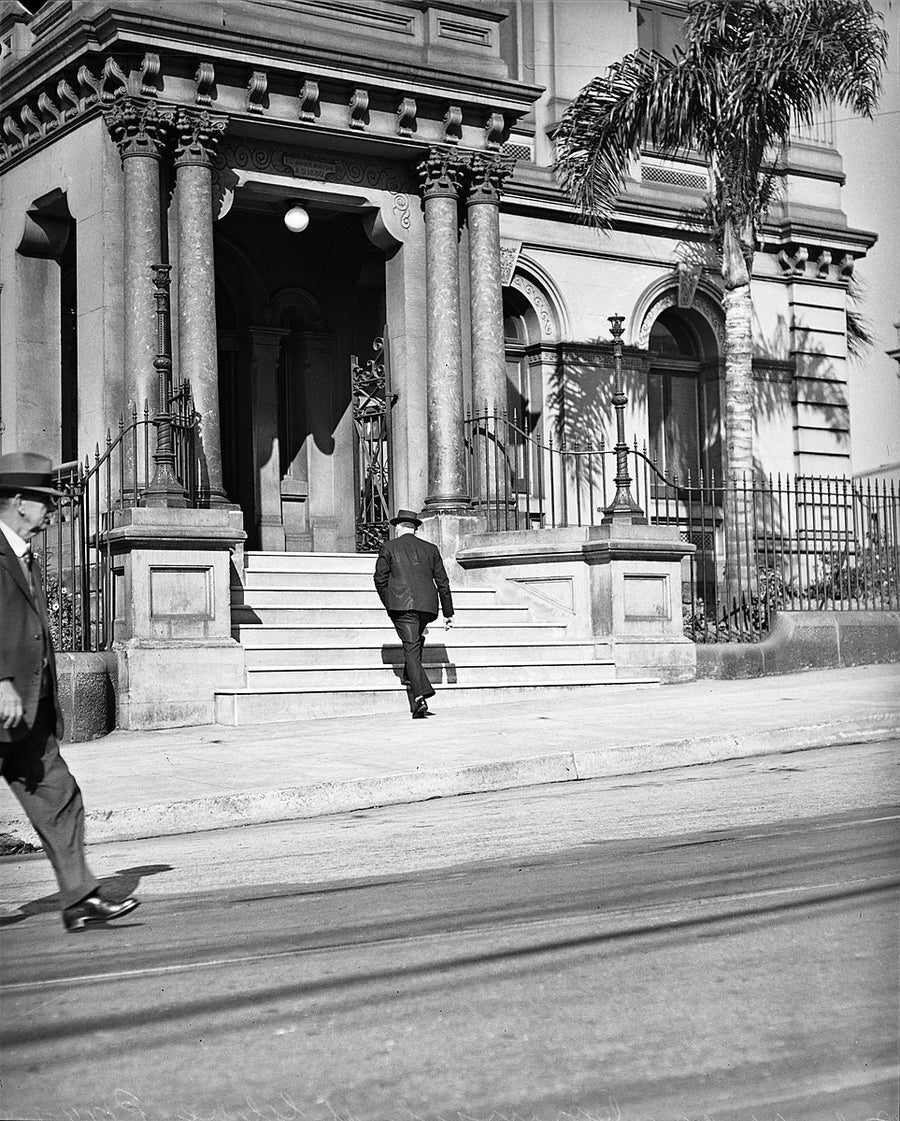 Columned porch and iron fence on a Glebe street — photograph, from Glebe, 1940