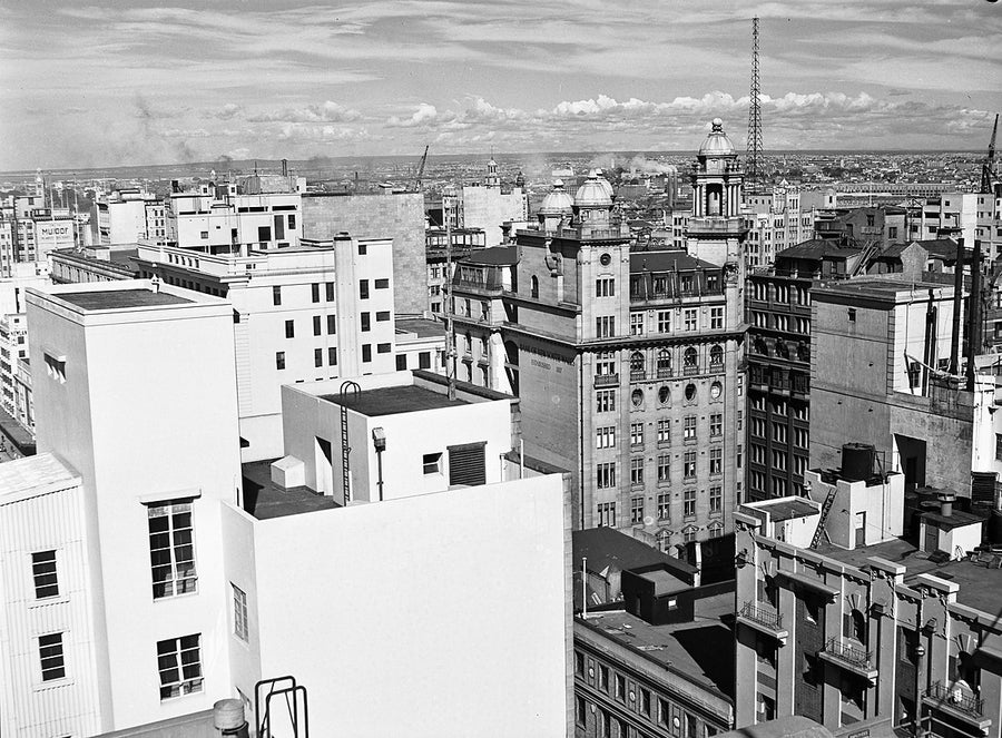 Sydney rooftops with Bank of New South Wales signage — photograph, from Sydney CBD, 1951
