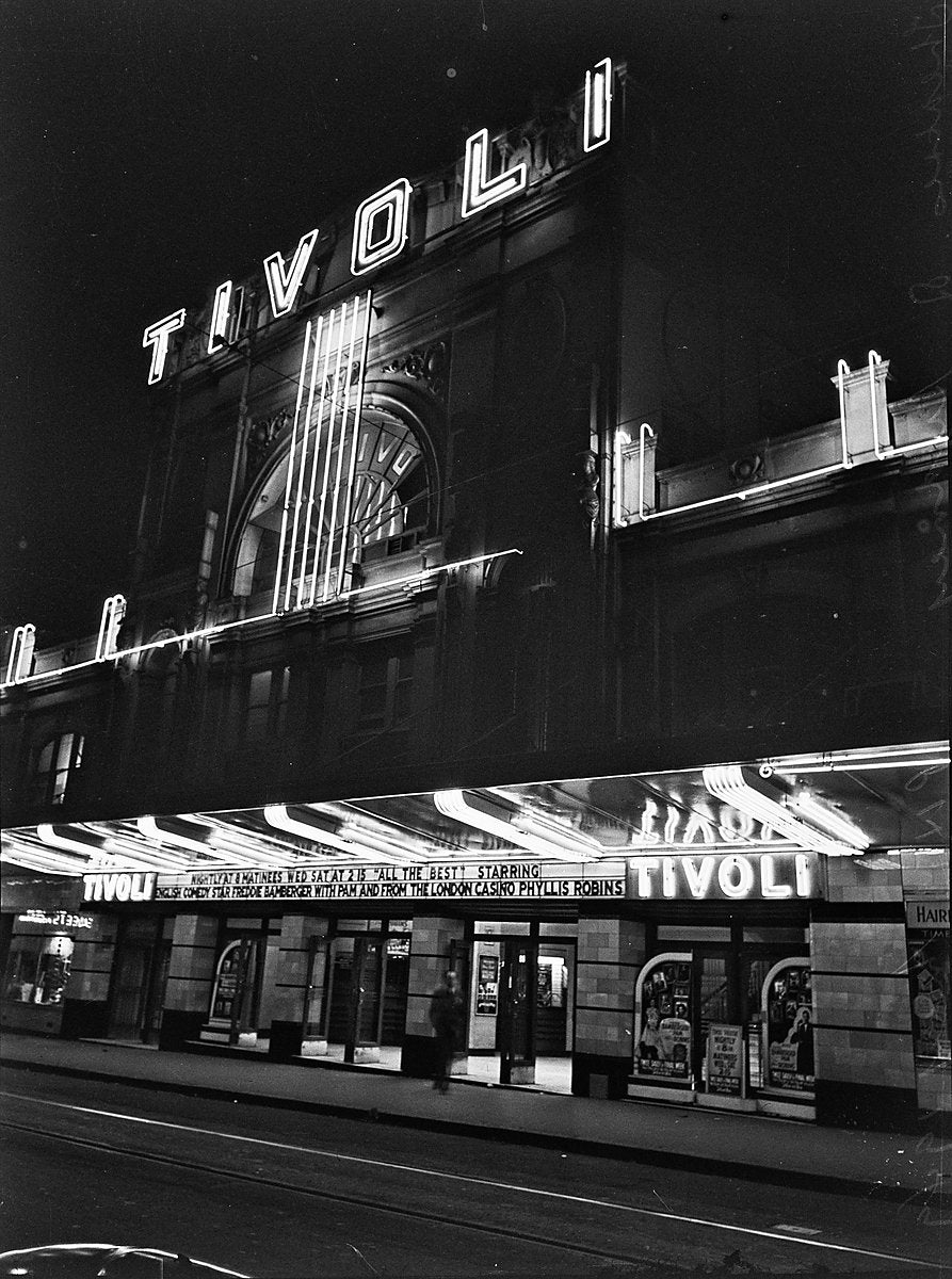 Neon-lit Tivoli Theatre frontage at night, Hay Street, Sydney — photograph, from Hay Street, 1949