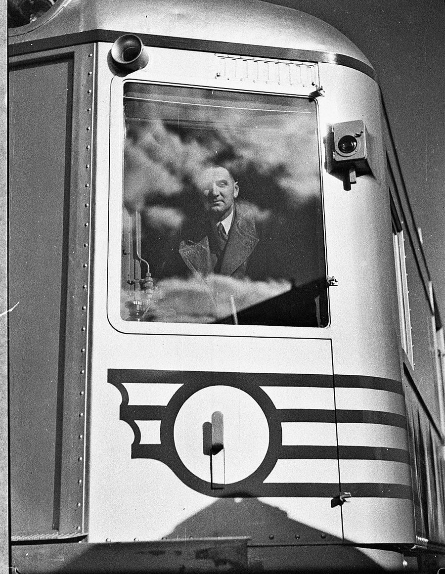 Silver City Comet driver at the cab window on its Moss Vale trial run — photograph, from Central Station, 1937