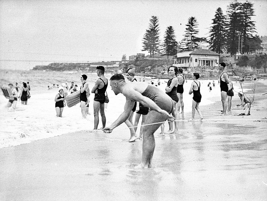 Surf bathers and a lifeline at Coogee Beach — photograph, from Coogee Beach, 1936