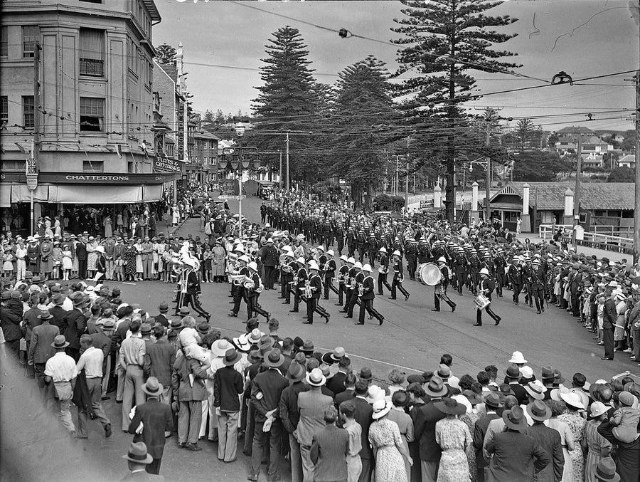 Military brass bands marching through Manly — photograph, from Manly, 1930s