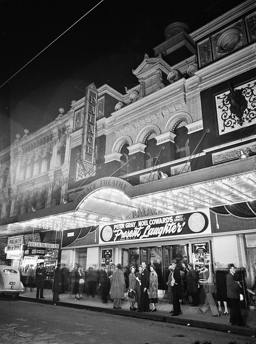 Palace Theatre, Pitt Street, lit at night for Noel Coward's "Present Laughter" — photograph, from Pitt Street, 1949