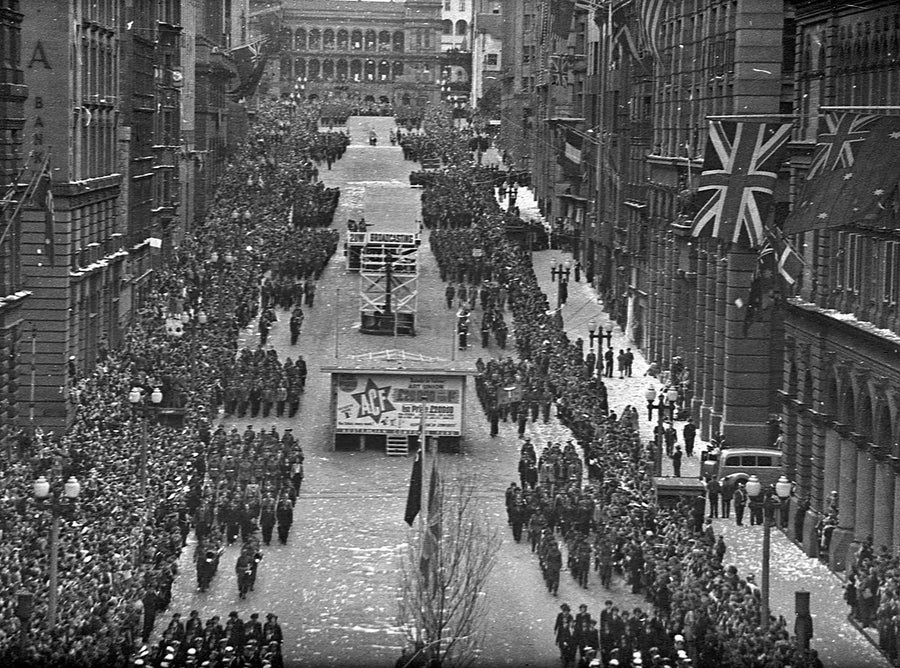 Victory parade and crowds for the end of the Second World War, Martin Place, Sydney — photograph, from Martin Place, 1945