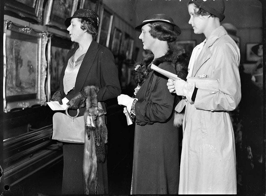 Visitors studying paintings, National Art Gallery of New South Wales — photograph, from Art Gallery of New South Wales, 1935