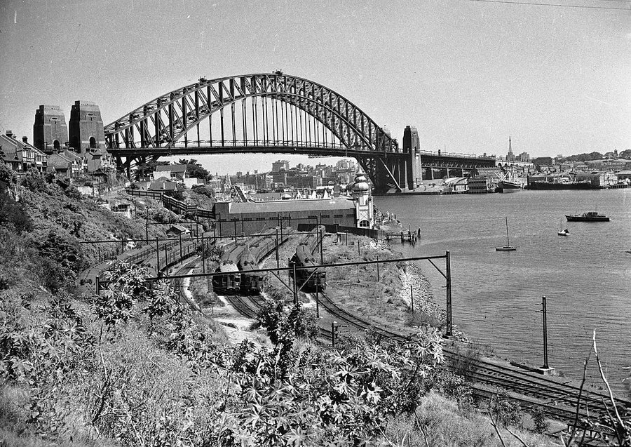 Sydney Harbour Bridge from Lavender Bay, with electric trains in the railway yards — photograph, from Lavender Bay, 1950