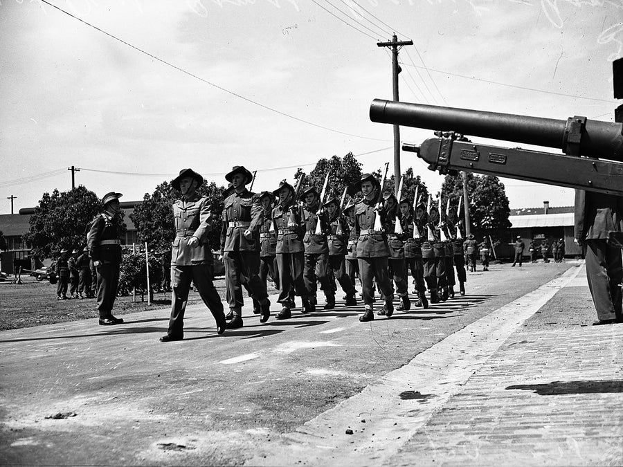 Army recruits marching past a field gun, Marrickville depot — photograph, from Marrickville, 1948