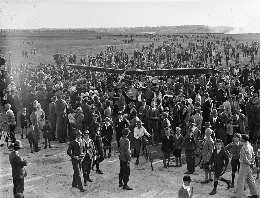 Crowd around a monoplane on Mascot aerodrome — photograph, from Mascot, c. 1927–30