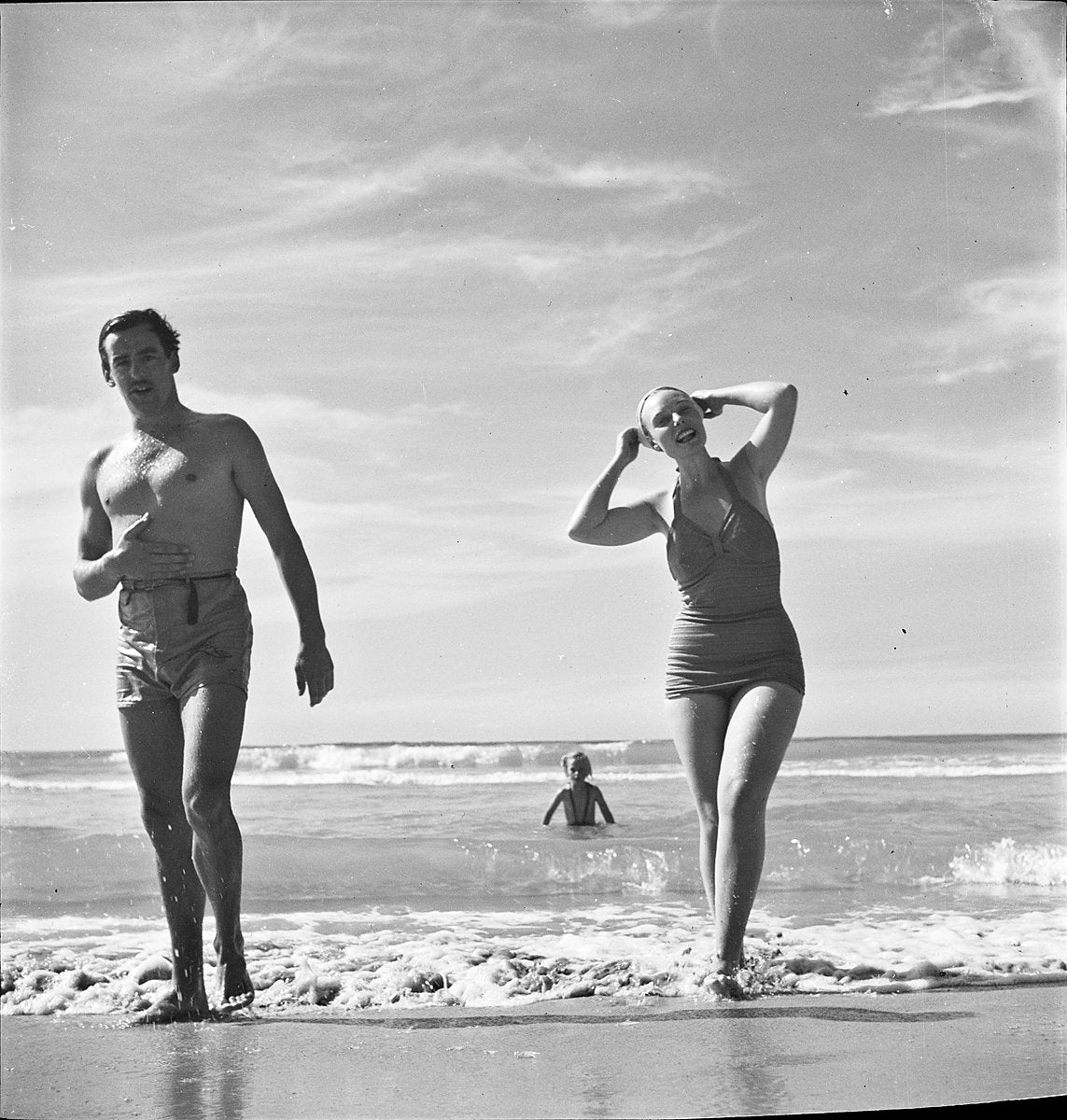 Qantas hostess Pam Waddell in the surf at Manly Beach, ca. 1950 — photograph, from Manly Beach, circa 1950