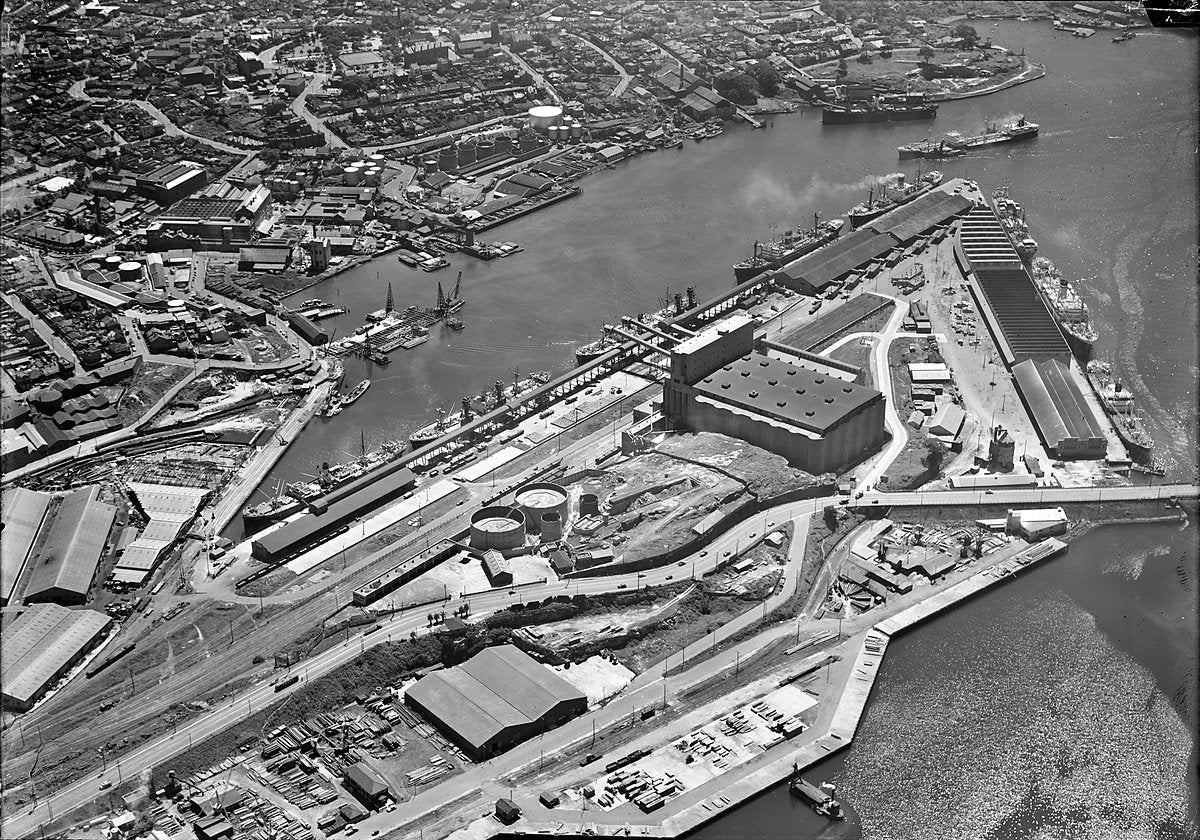 Glebe Island oil terminal and harbour shipping, aerial view — photograph, from Rozelle, 1924–50