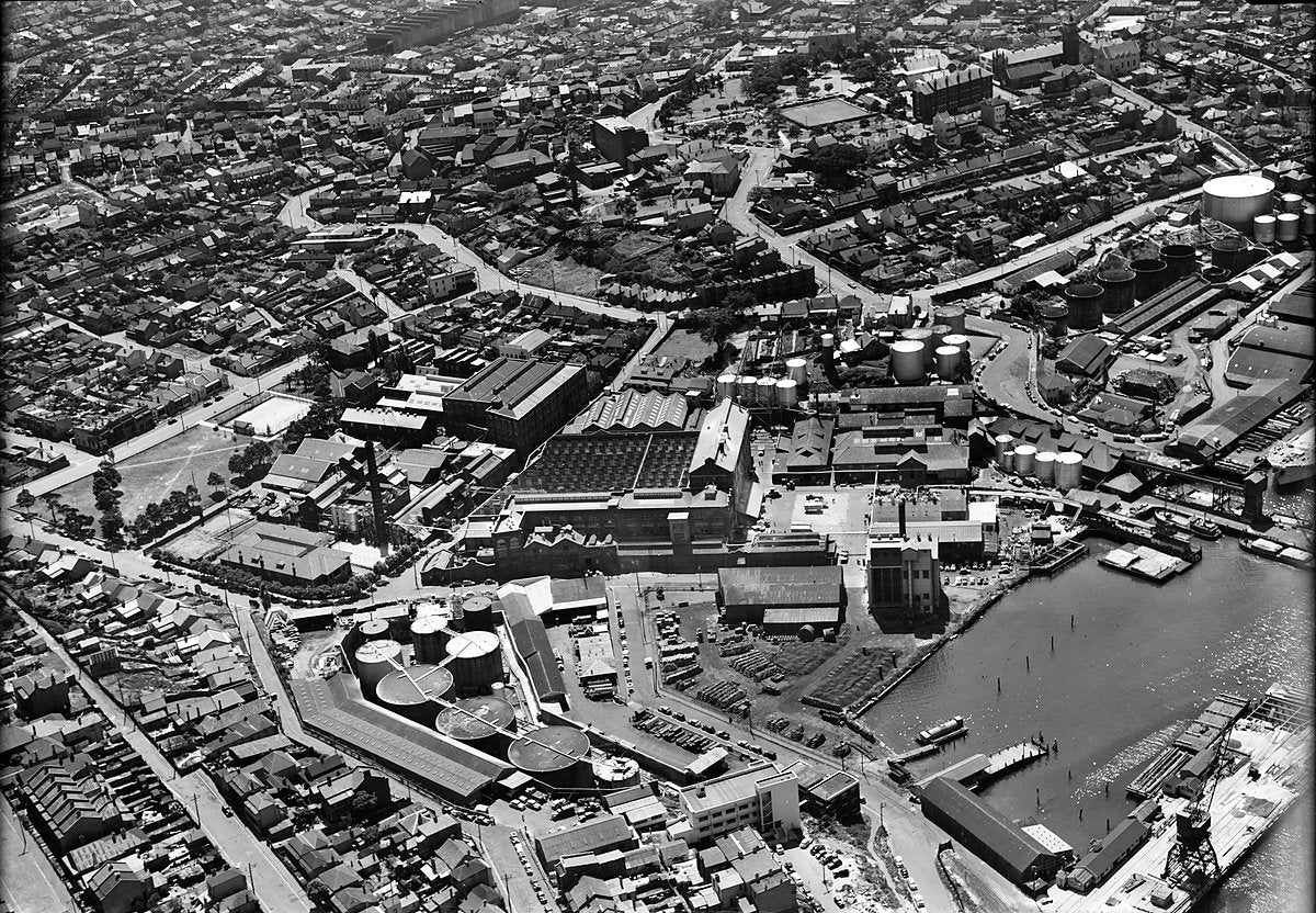 Ampol oil terminal on the Balmain waterfront, aerial view — photograph, from Balmain, c. 1950