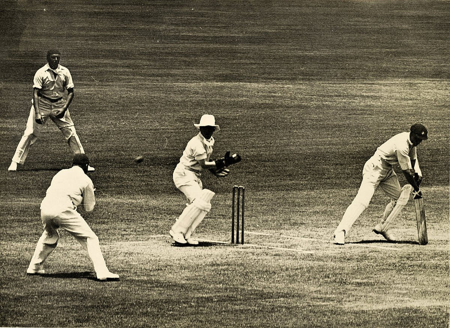 Batsman, wicket-keeper and fielders in play during a Sydney cricket match — photograph, from Sydney CBD, circa 1937