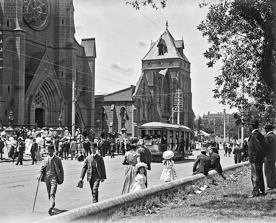 Crowds outside St Mary's Cathedral, Sydney, as a tram passes — photograph, from St Mary's Cathedral, circa 1898
