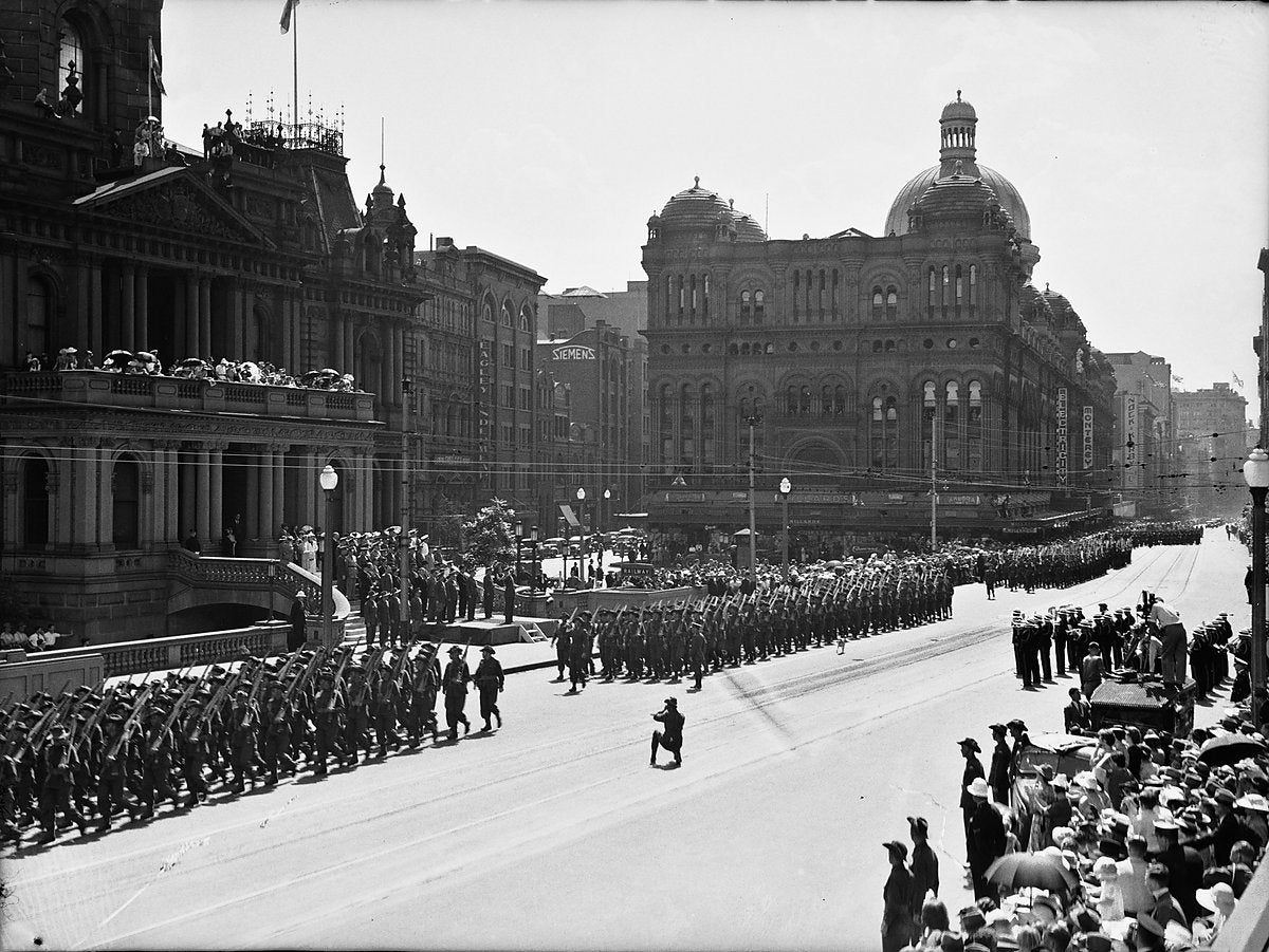 2nd AIF troops march past Sydney Town Hall — photograph, from Sydney Town Hall, circa 1937