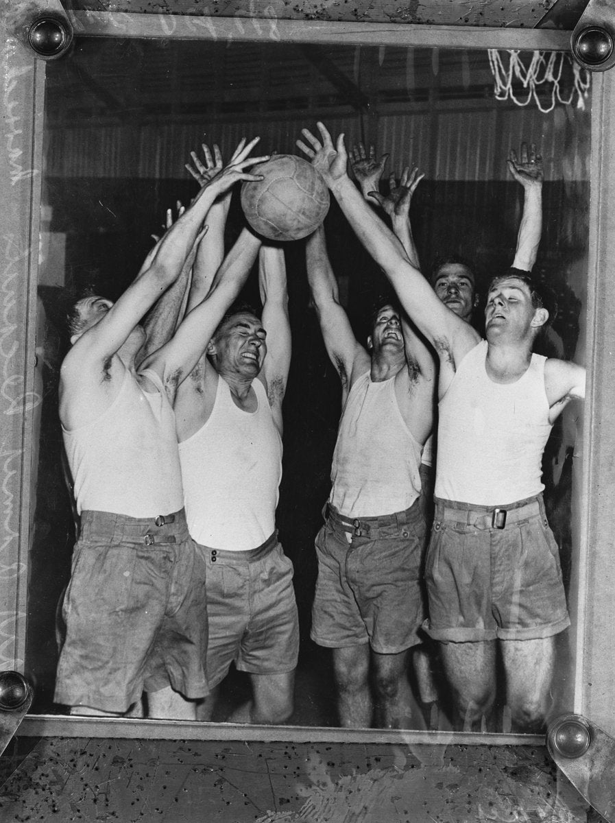 Army recruits contest a basketball, Marrickville depot — photograph, from Marrickville, circa 1948