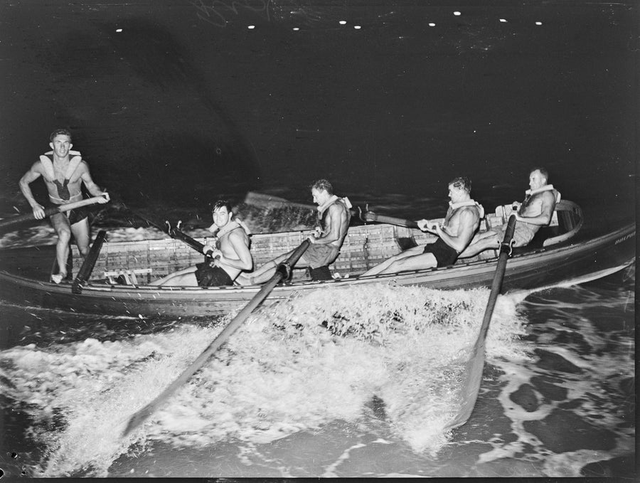 Coogee surf boat crew at the oars, night training, 1946 — photograph, from Coogee Beach, circa 1946