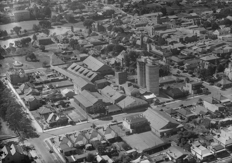 Meggitt Ltd Linseed Oil Mills from the air, with silos and surrounding terraces — photograph, circa 1939