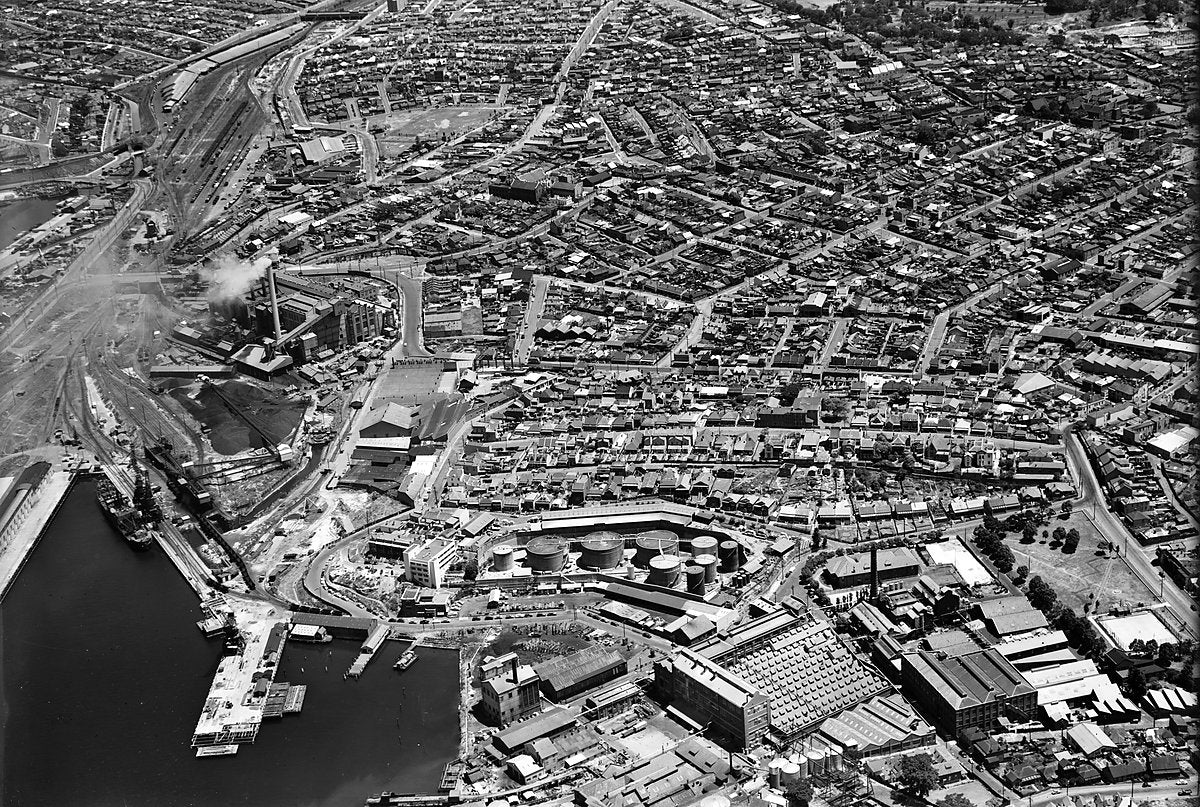 Ampol terminal and Balmain waterfront from the air — photograph, from Balmain, c. 1950