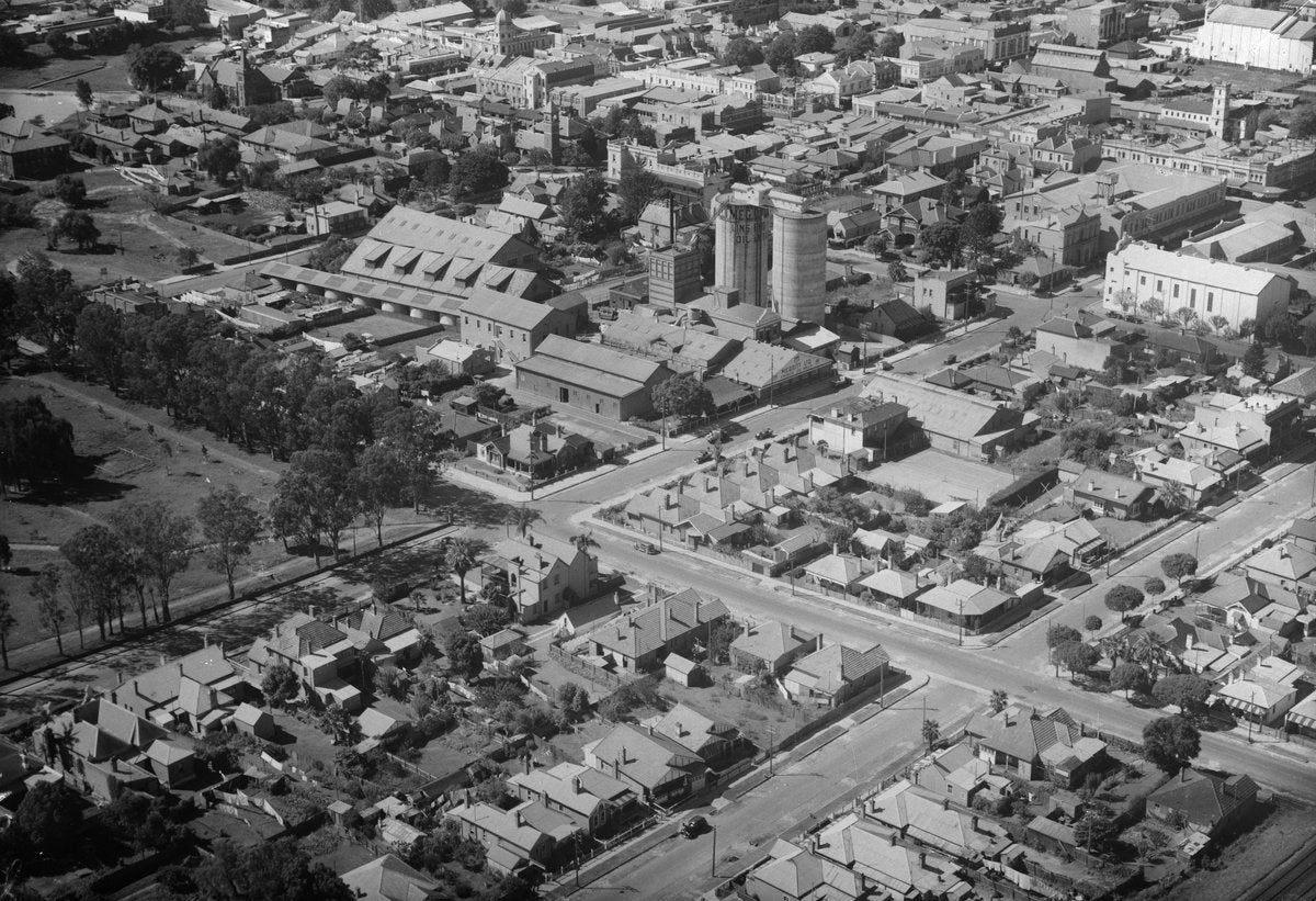 Meggitt's Linseed Oil silos above the rooftops of Parramatta — photograph, from Parramatta, circa 1939