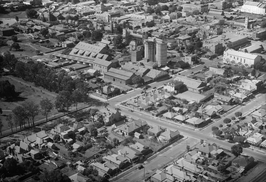 Meggitt's Linseed Oil silos above the rooftops of Parramatta — photograph, from Parramatta, circa 1939