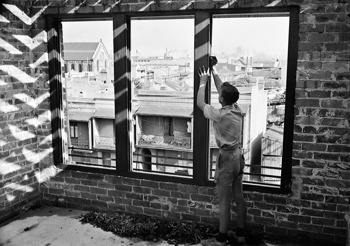 Man at work on a window frame, Surry Hills, 1950 — photograph, from Surry Hills, circa 1950