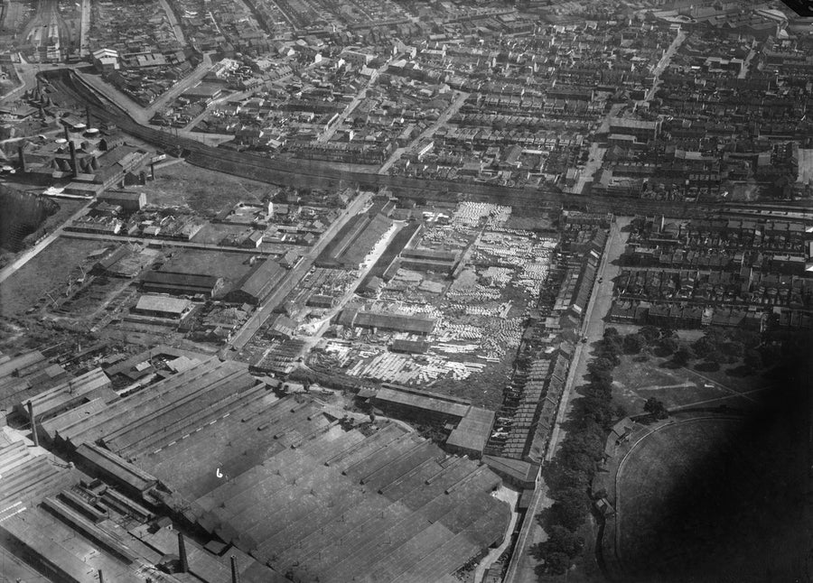 Aerial view over an Alexandria industrial precinct with pipe yards and terraced housing — photograph, from Alexandria, circa 1930