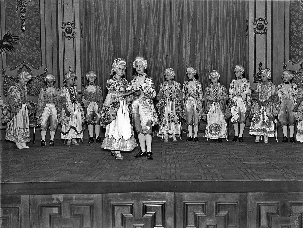 Children in eighteenth-century court dress posed on stage — photograph, from Sydney CBD, circa 1923