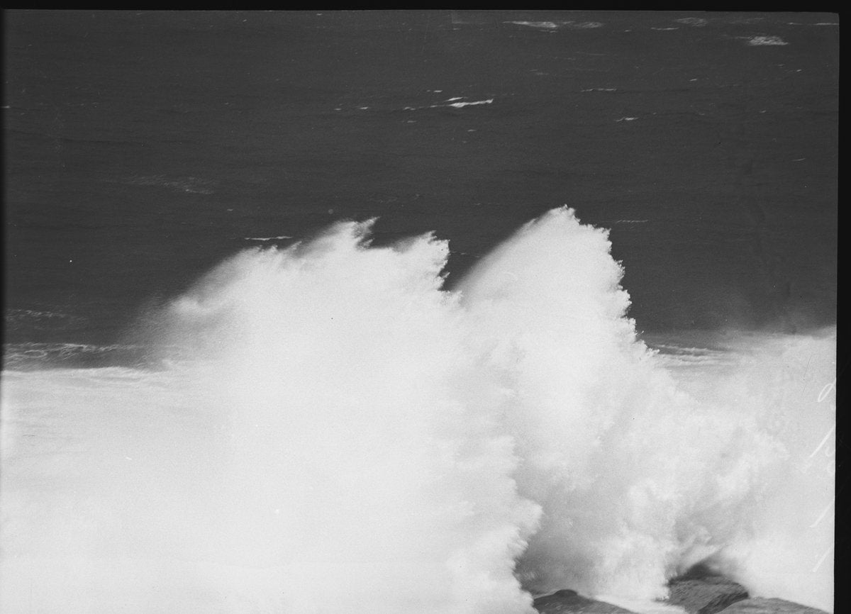 Surf breaking on rocks at Bondi, October 1940 — photograph, from Bondi Beach, circa 1940