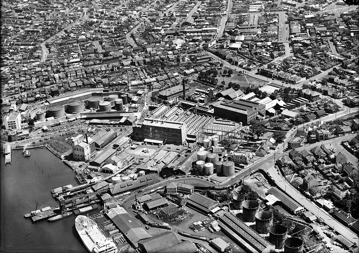 Ampol oil depot, Buchanan Street, Balmain, from the air — photograph, from Balmain, c. 1950