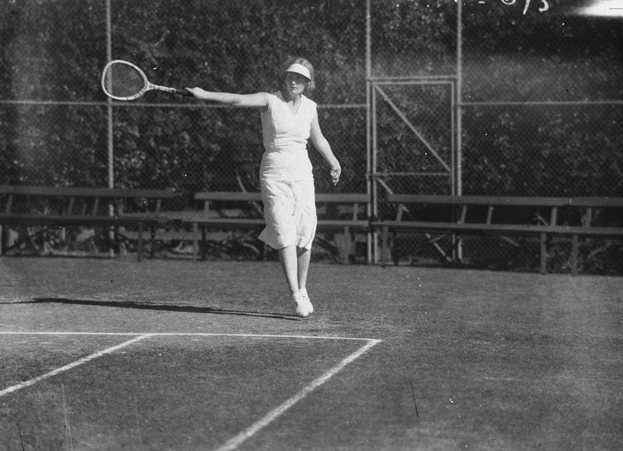 Woman tennis player mid-stroke, Sydney, 1934 — photograph, from Sydney Cricket Ground, Moore Park, circa 1934