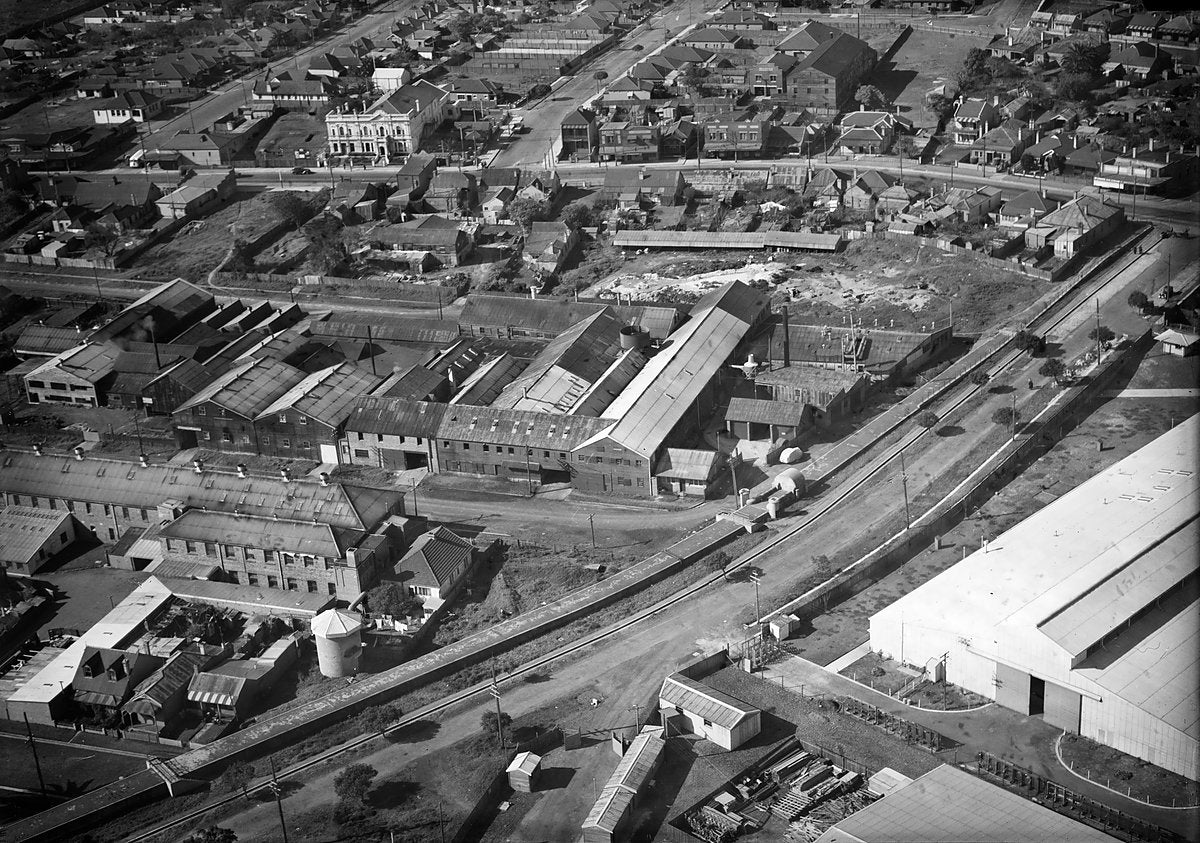 Factory rooftops and terrace streets from the air, Sydney — photograph, c. 1940