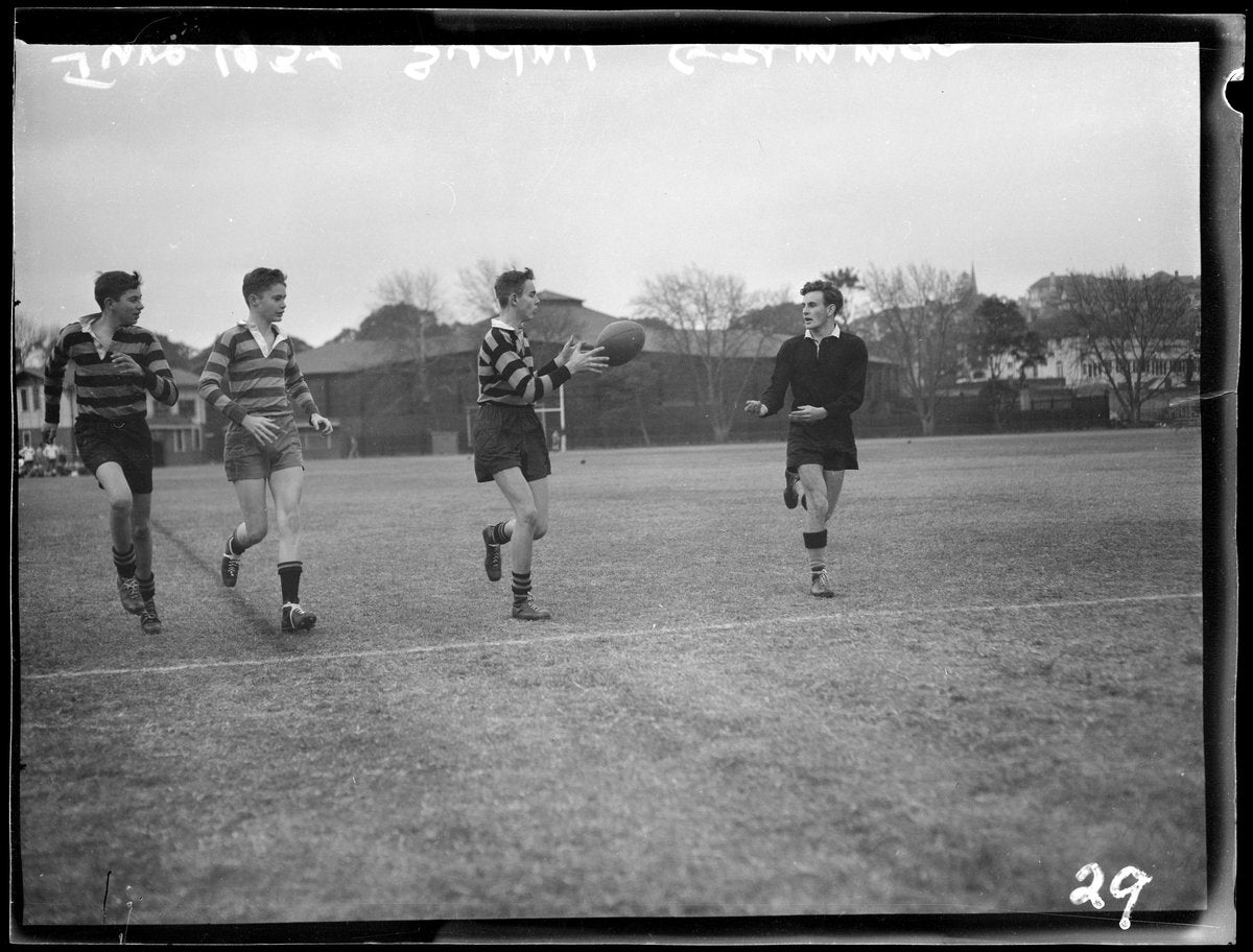 Schoolboy rugby players passing the ball, Sydney Grammar, 1954 — photograph, from Sydney Grammar School, Sydney, circa 1954