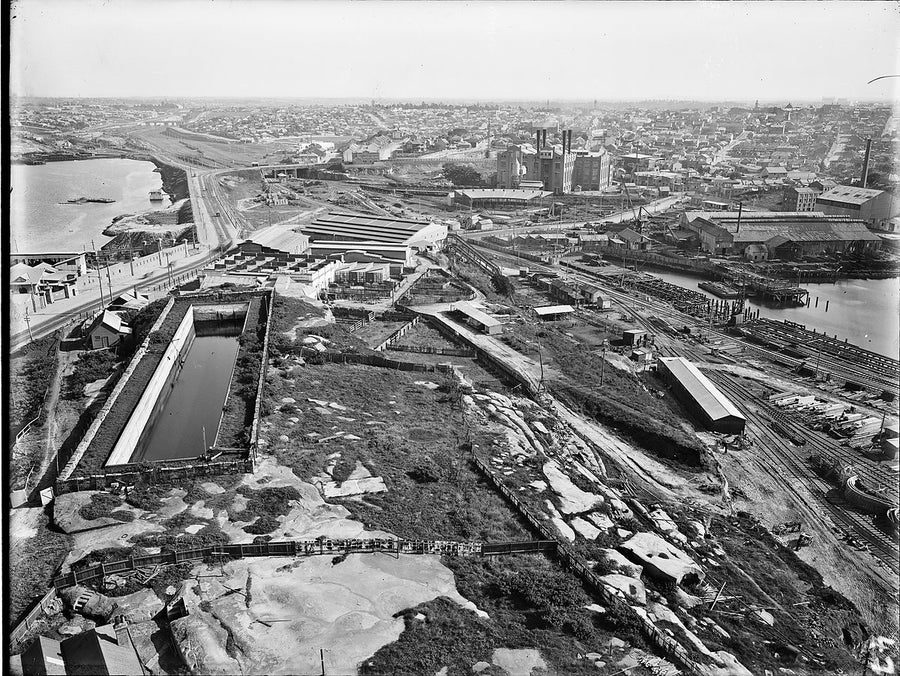 Glebe Island wharfage and rail yards before the wheat silos — photograph, from Rozelle, c. 1920–25