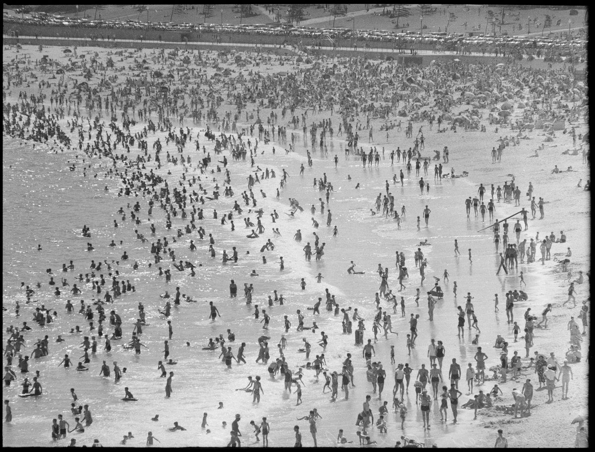 Summer crowds packing a Sydney surf beach — photograph, from null, circa 1950
