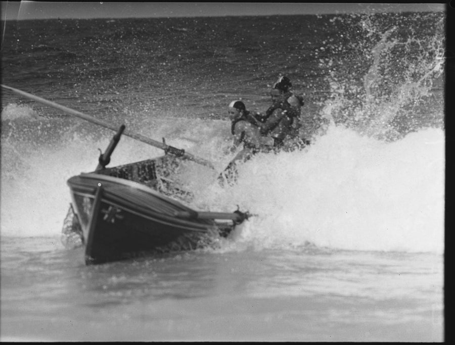 Surf boat crew driving through the break, Coogee — photograph, from Coogee Beach, circa 1952