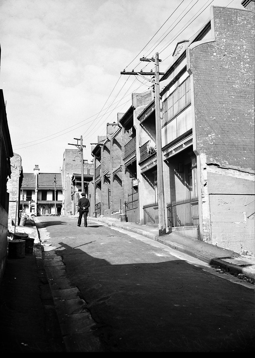 Terrace houses along a Surry Hills street, 1950 — photograph, from Surry Hills, circa 1950