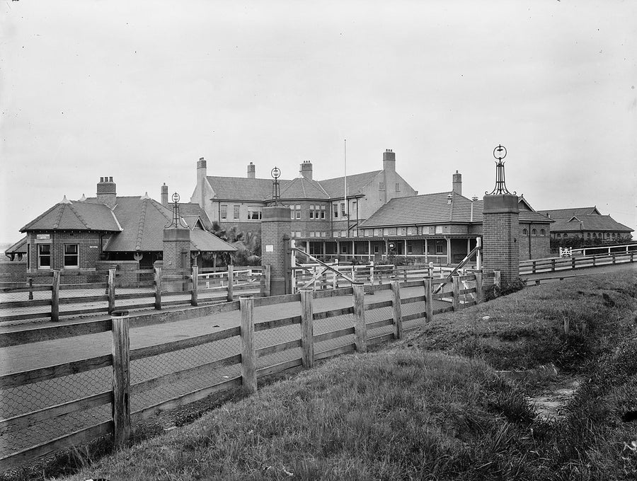 State Meat Works, Homebush — entrance gates and main buildings — photograph, from Homebush, c. 1924–27