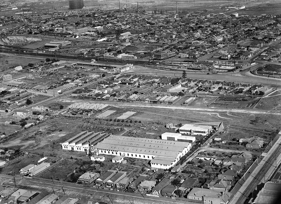 Factories, terrace housing and railway yards, Sydney, aerial view by Milton Kent — photograph, 1930s