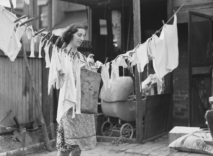 Woman with washing on the line, Erskineville backyard — photograph, from Erskineville, circa 1938