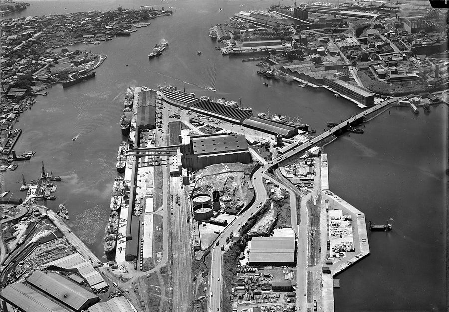 Glebe Island wharves and Vacuum Oil tanks from the air — photograph, from Rozelle, 1924–50