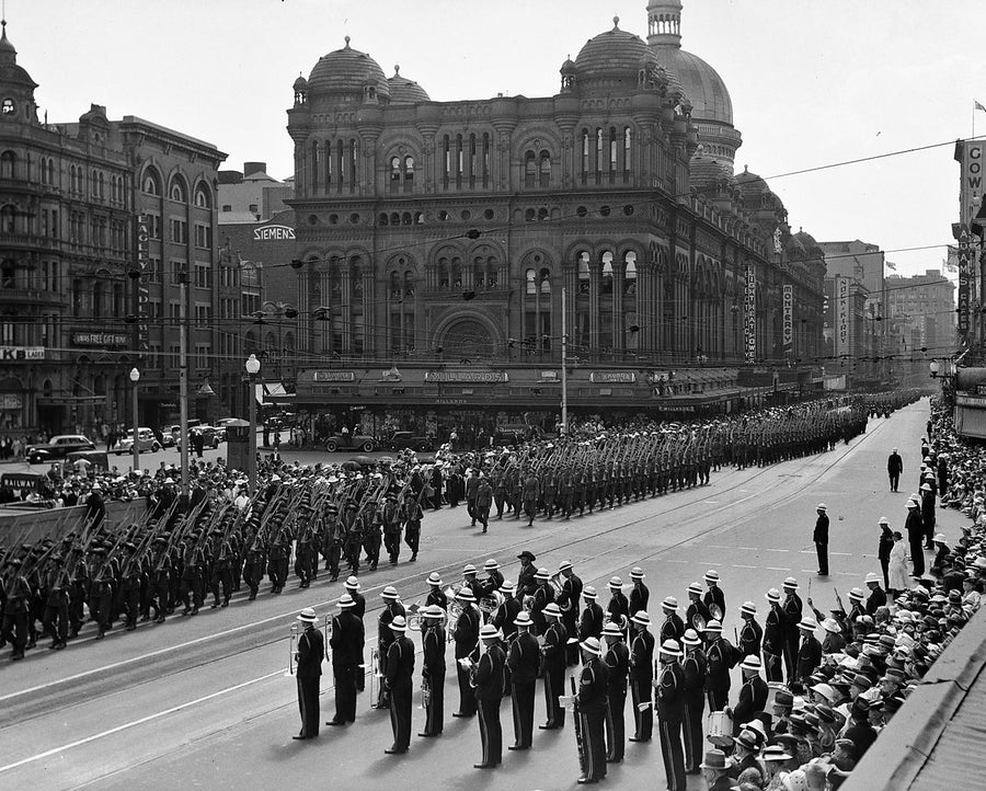 Second AIF troops marching past the Queen Victoria Building, George Street — photograph, from Sydney CBD, 1940
