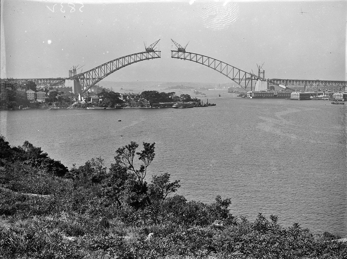 Sydney Harbour Bridge arch under construction, c.1930 — photograph, from Fitzroy Street, circa 1930